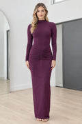 Full front view of model wearing Plum mock neck long sleeve ruched maxi dress