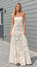 Model wearing cream floral lace cami maxi dress front view