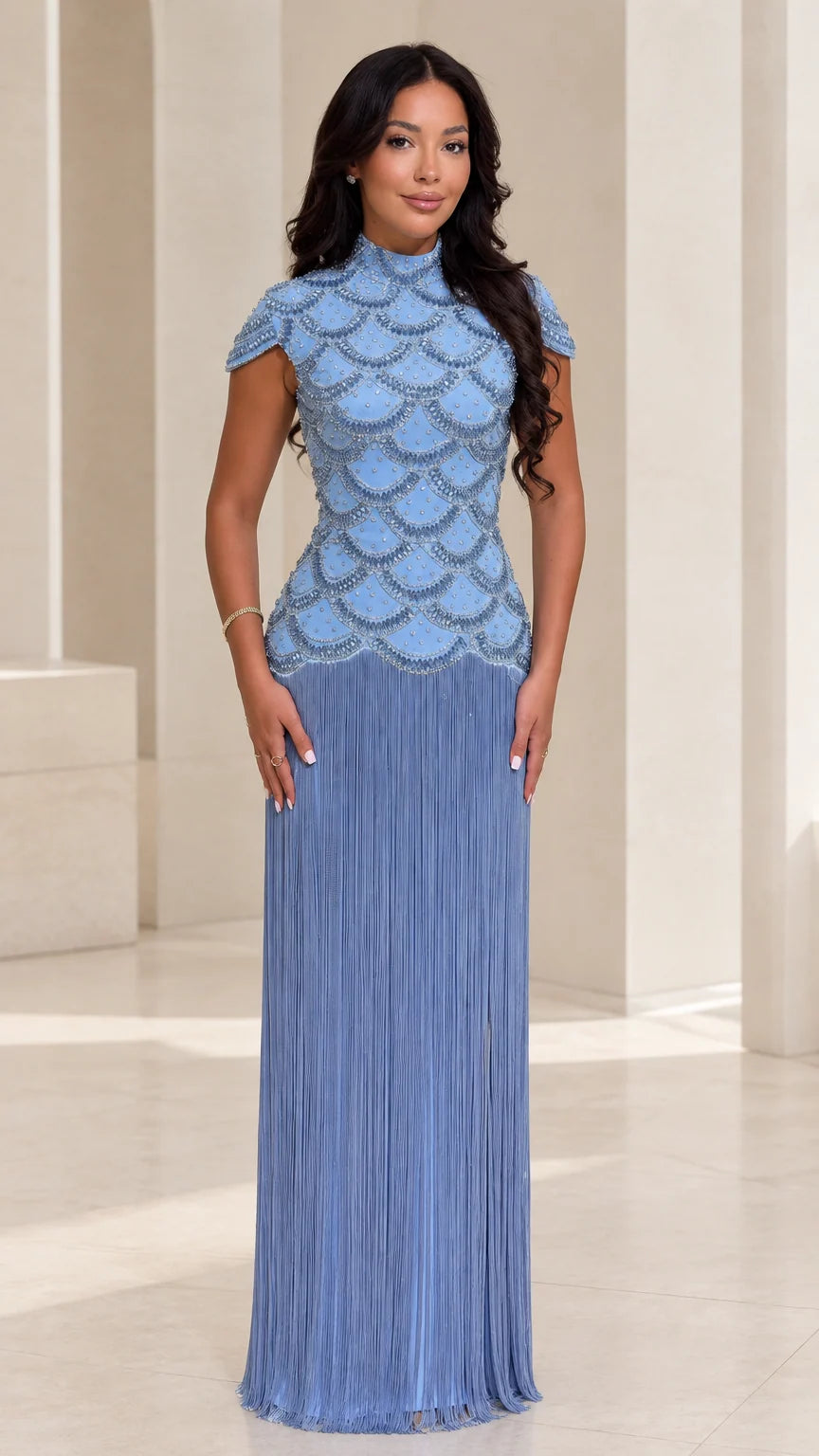 Front view of woman wearing Dusty Blue beaded scallop bodice maxi dress with fringe skirt