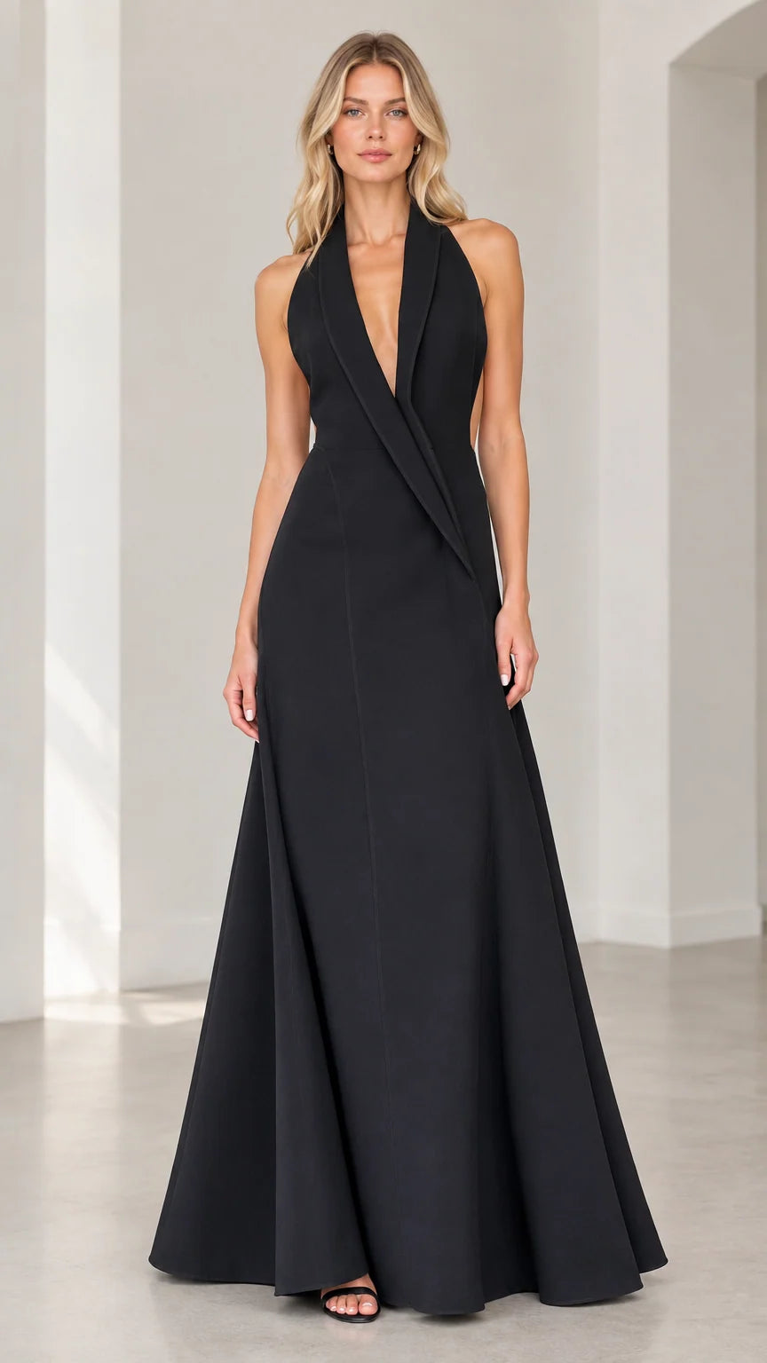 Front view of black halter tuxedo lapel backless evening gown on model