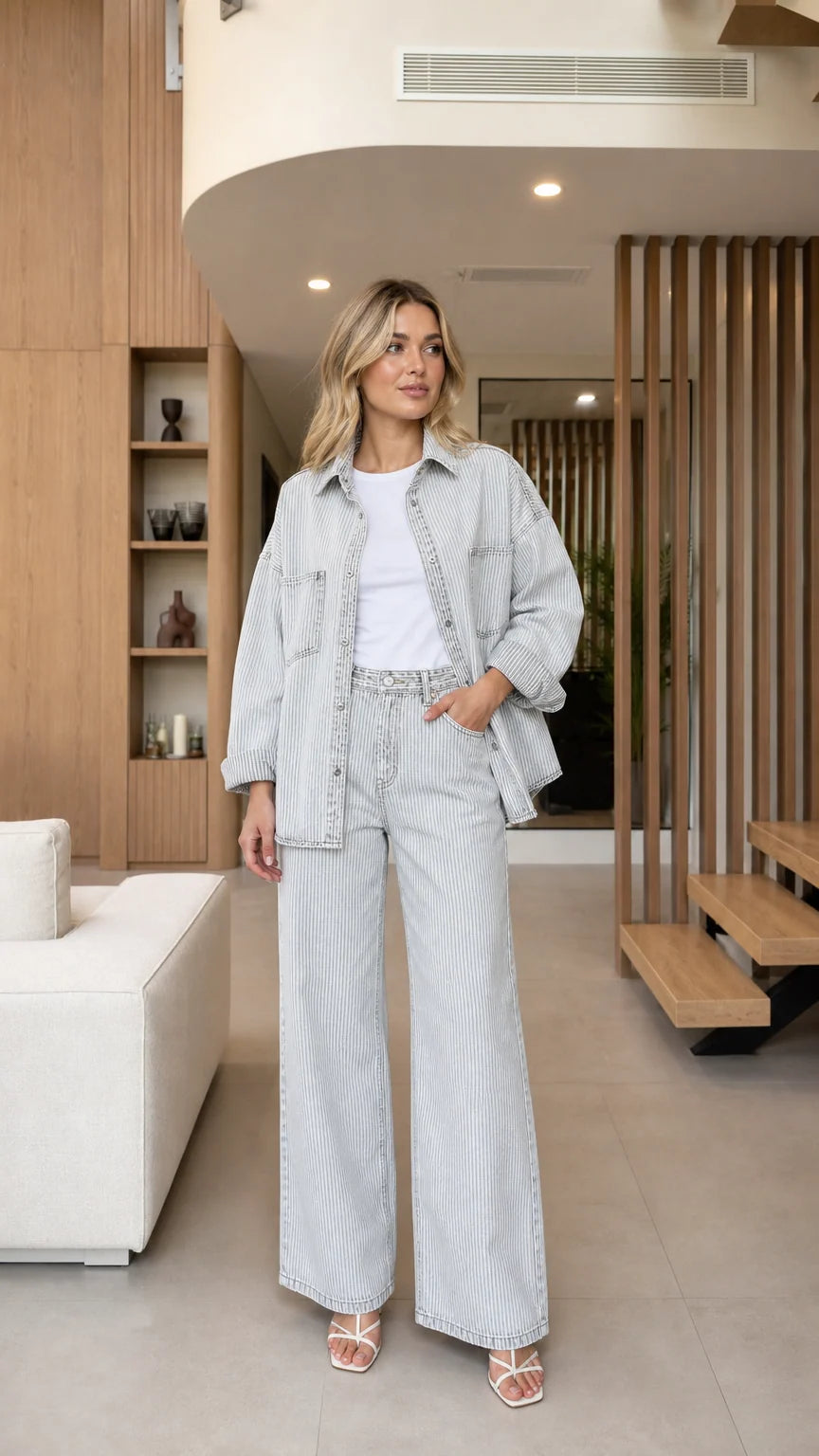 Front view of model wearing Light Blue striped denim shirt jacket and wide-leg pants set