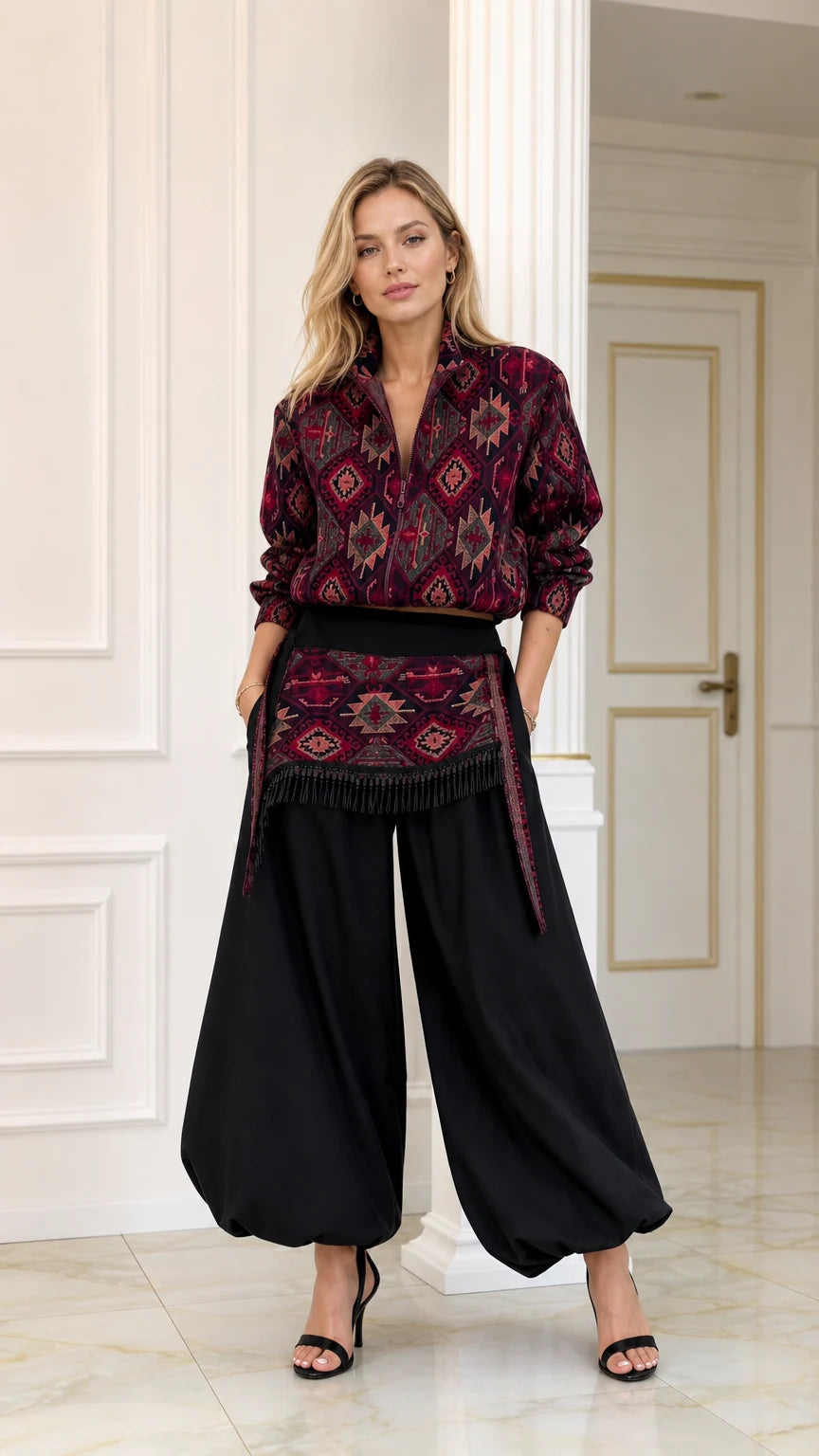 Front full view of woman wearing burgundy geometric print blouse and black balloon pants set