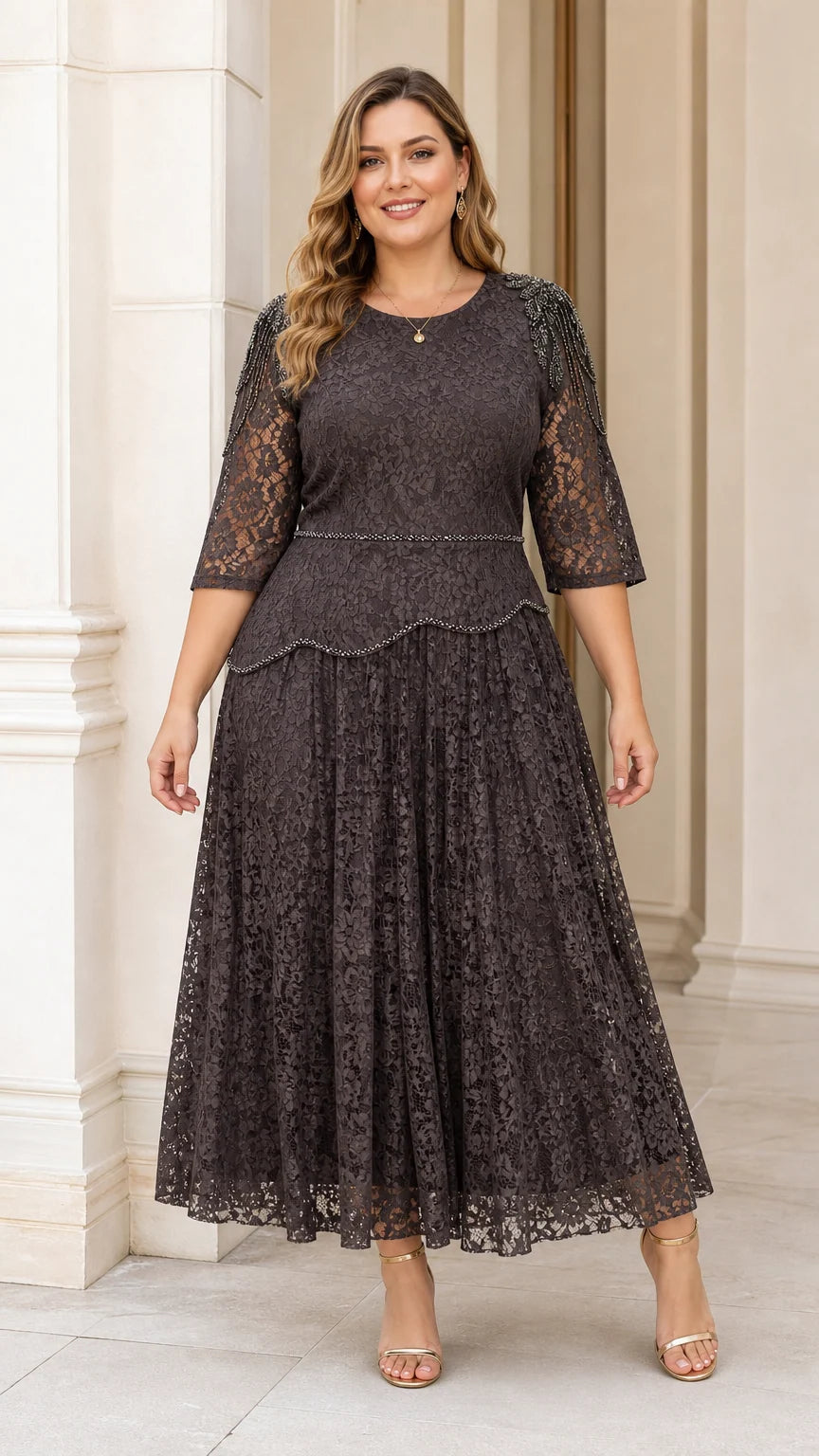 Front view of plus size model wearing dark charcoal beaded lace midi dress