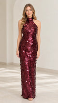 Front view of model wearing burgundy sequin high neck halter maxi gown