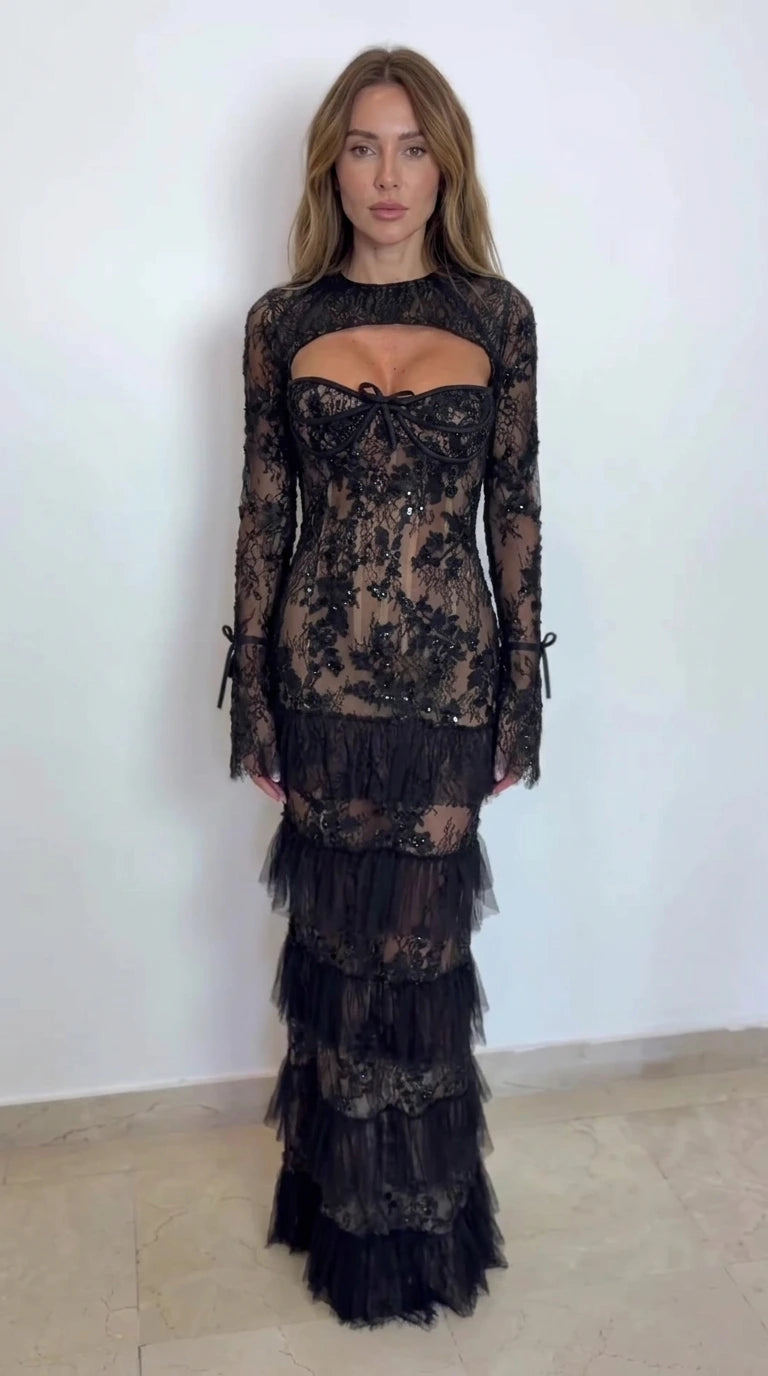 Front view of black lace cutout corset tiered maxi evening dress on model