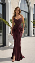 Front view of burgundy beaded strapless mermaid evening dress