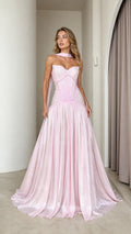 Front view of model wearing pink pleated strapless maxi dress