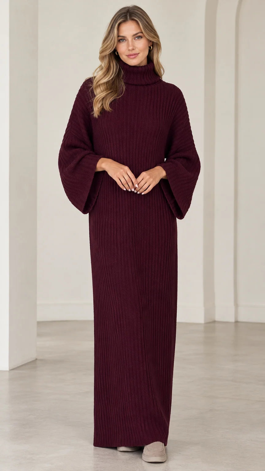 Full front view of model wearing burgundy turtleneck ribbed knit maxi sweater dress with flared sleeves