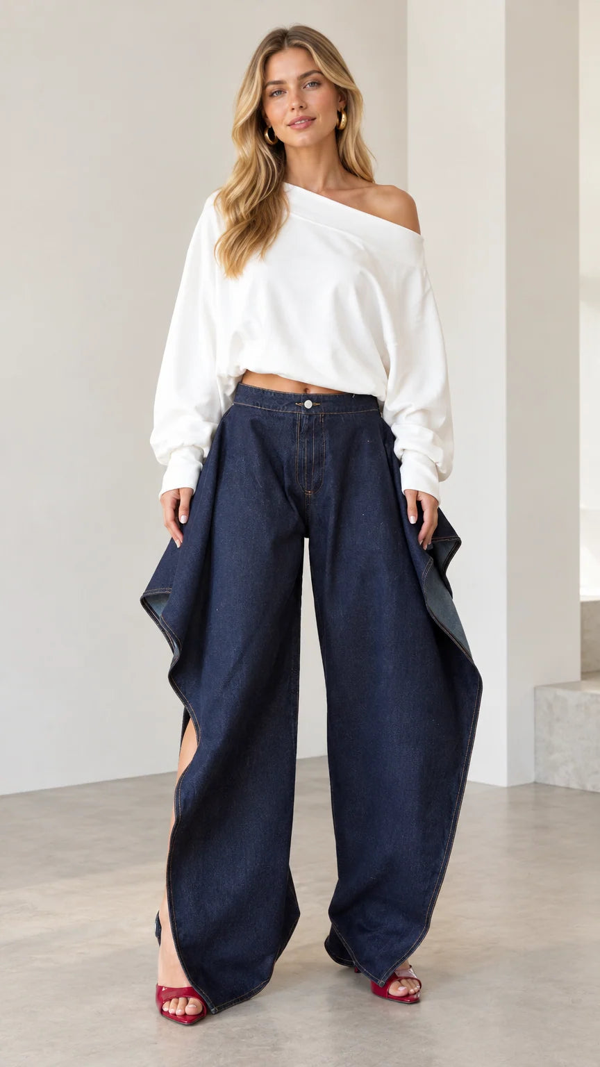 Front full view of women wearing dark blue draped wide-leg denim pants paired with a white off-shoulder top