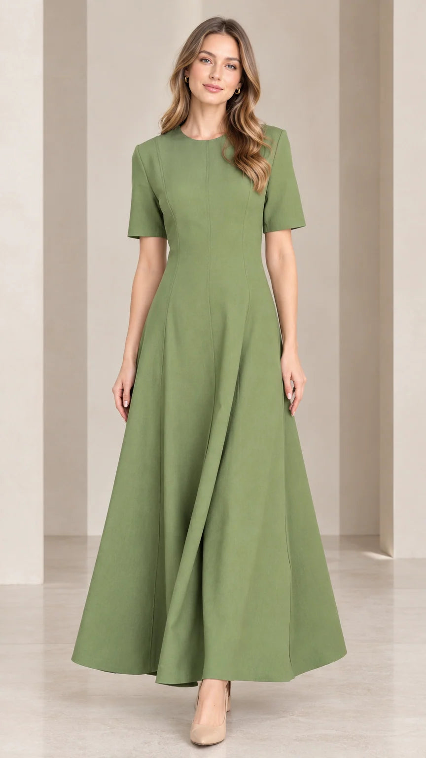 Front view of woman wearing sage green short sleeve A-line maxi dress