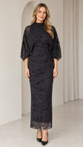 Front view of black mock neck beaded column evening dress with sheer dolman sleeves