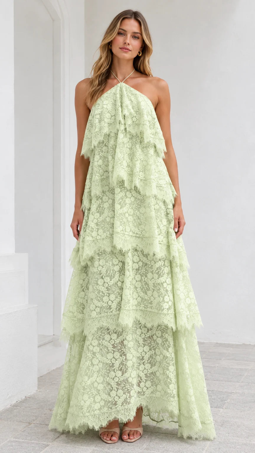 Front view of model wearing Mint Green halter tiered floral lace maxi dress