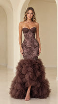 Front view of model wearing chocolate brown strapless beaded lace mermaid gown with tiered ruffle skirt