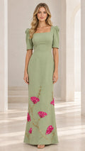 Front full view of woman wearing sage green square neck maxi dress with floral embroidery