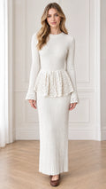 Front full view of woman wearing cream ribbed knit peplum maxi dress with lace detailing