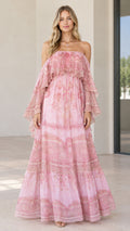 Front view of woman wearing pink paisley tiered cold-shoulder maxi dress
