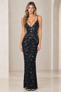 Front view of model wearing black embellished V-neck maxi dress