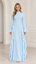 Front view of woman wearing Light Blue mock neck long sleeve maxi dress with side cascade ruffles