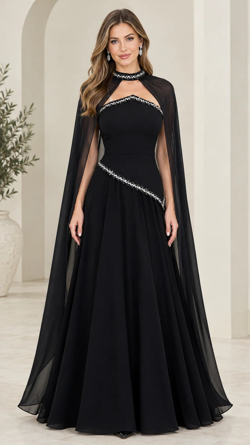 Front full-length view of model wearing black rhinestone high-neck cape evening gown
