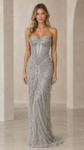 Front view of model wearing a floor-length strapless silver beaded fringe evening gown