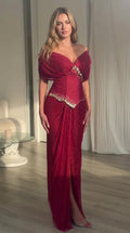 Full front view of model wearing burgundy off-the-shoulder embellished basque waist maxi dress