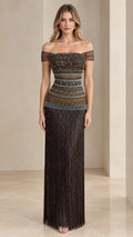 Front view of woman wearing off-the-shoulder beaded fringe evening gown in dark bronze