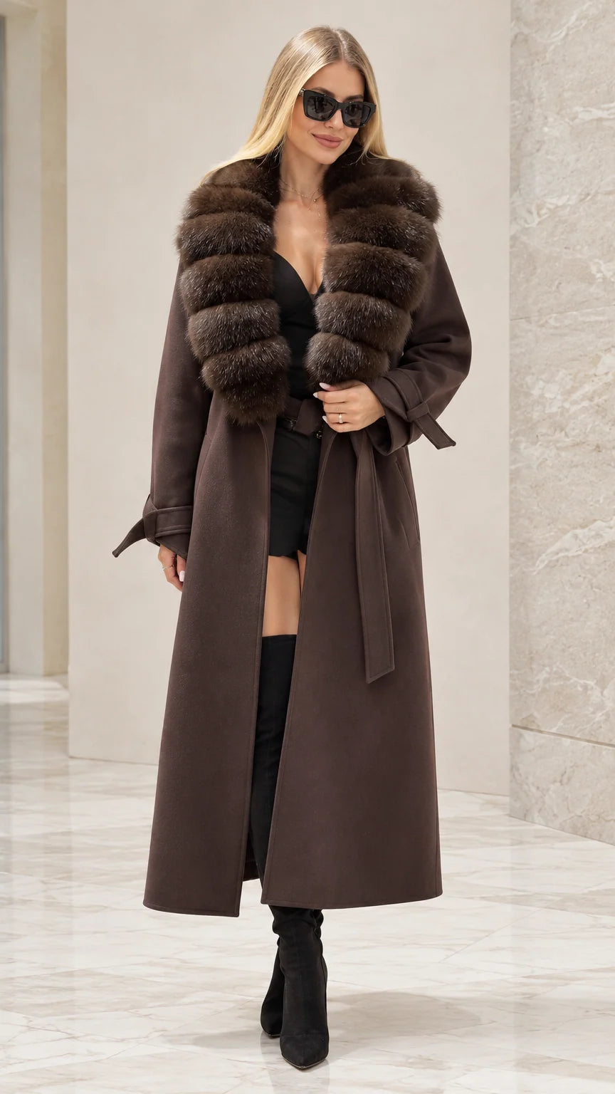 Front full view of woman wearing brown maxi trench coat with faux fur collar and belt