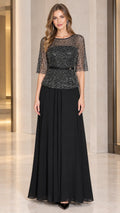 Front view of woman wearing black sequin mesh half sleeve maxi evening dress