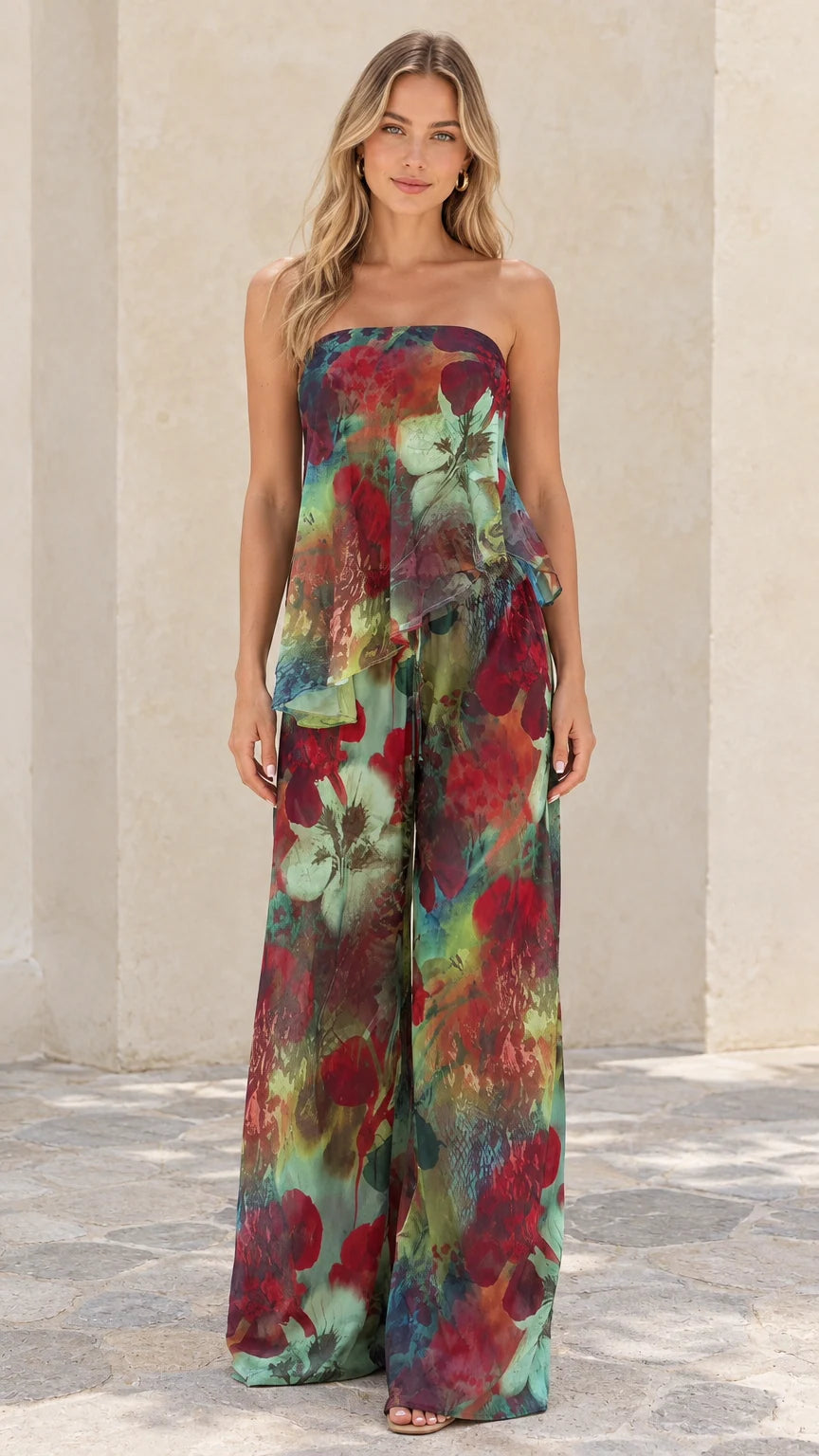 Front full view of woman wearing teal floral strapless tiered top and wide-leg pant set