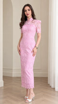 Full front view of model wearing pink mock neck lace column maxi dress with heels