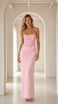 Model wearing pink strapless beaded corset maxi evening gown front view