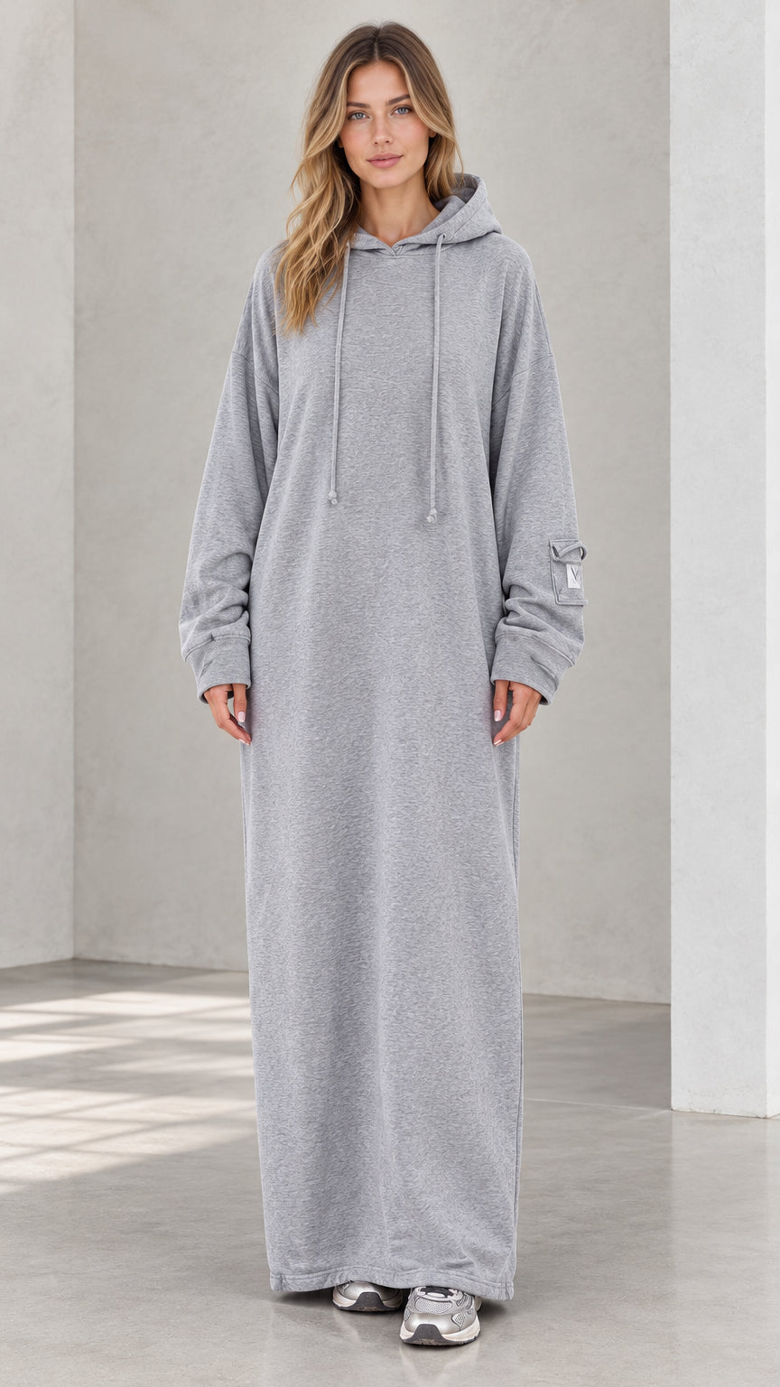 Full front view of model wearing heather grey oversized maxi hoodie dress