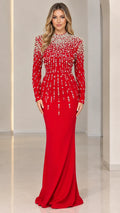 Front view of model wearing a vibrant red pearl-embellished long sleeve mermaid evening gown