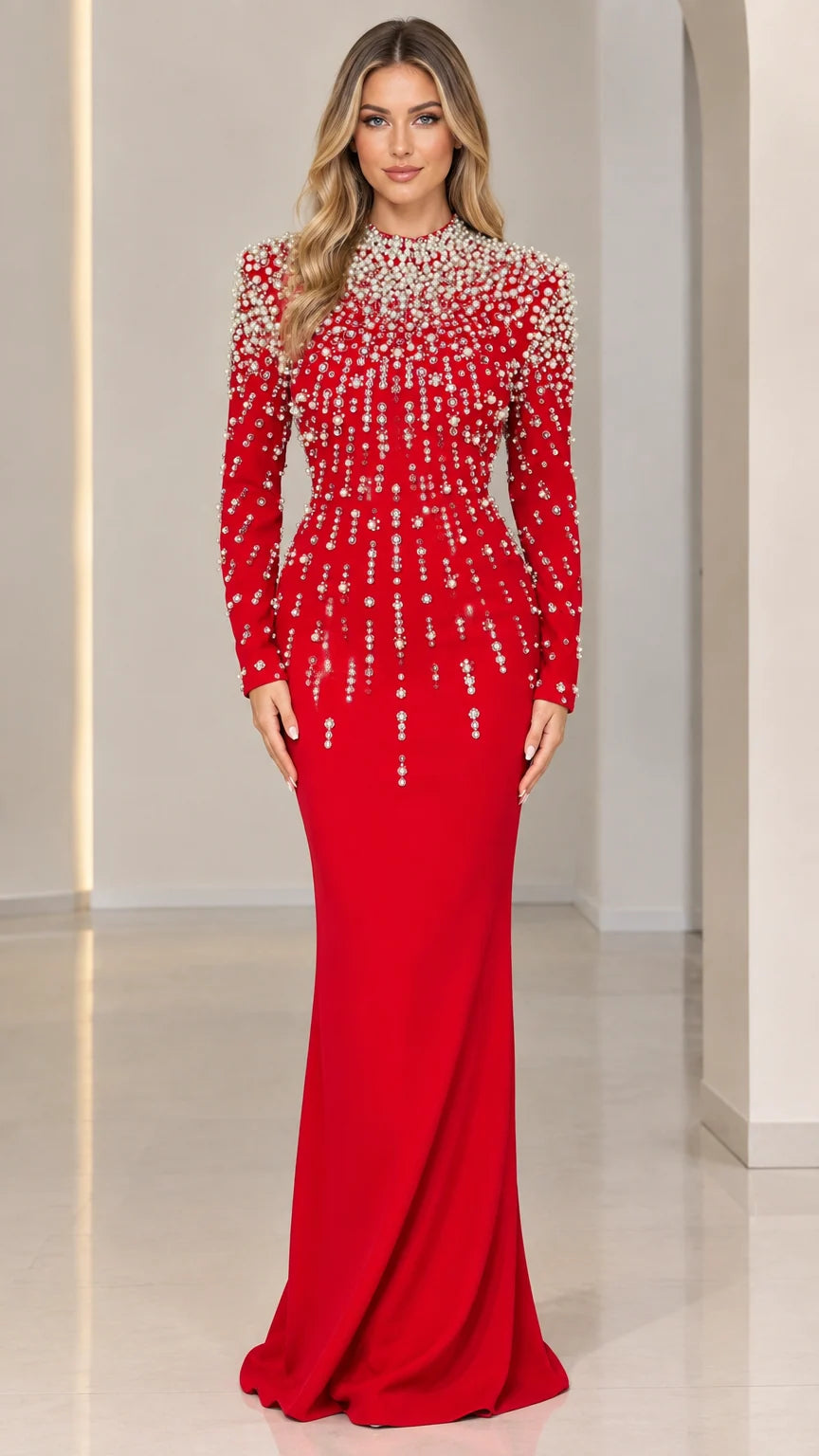 Front view of model wearing a vibrant red pearl-embellished long sleeve mermaid evening gown
