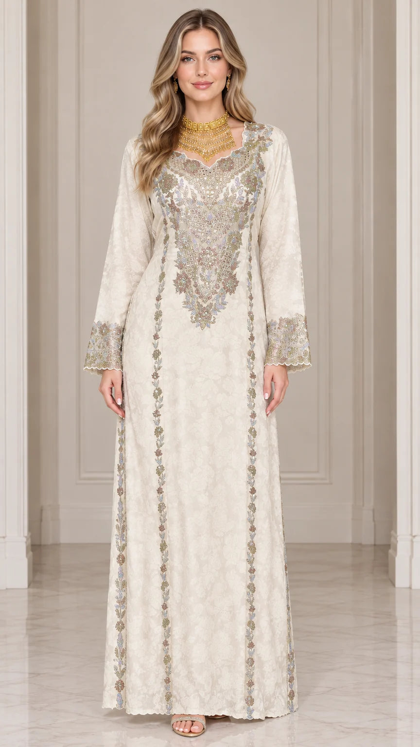 Front full-length view of woman wearing ivory embroidered long sleeve maxi kaftan dress