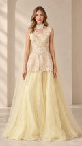 Front view of model wearing Champagne Yellow floral beaded peplum gown with tulle skirt and cape