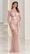 Front view of model wearing dusty pink high neck beaded evening gown with satin belt