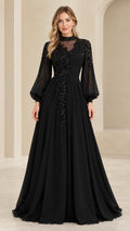 Full front view of black sequin embroidered illusion neckline long sleeve evening gown