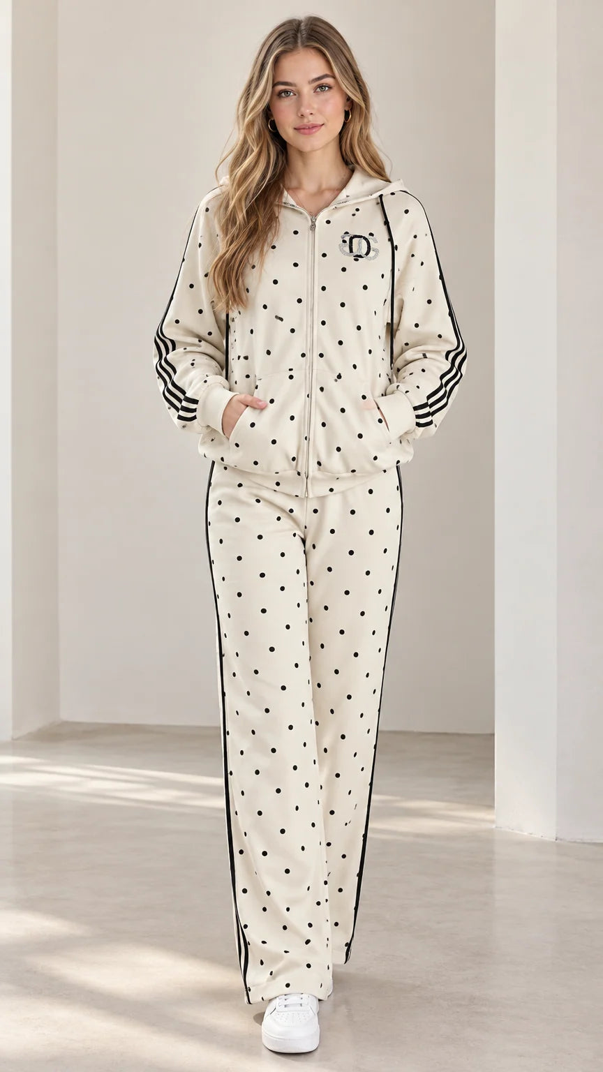 Full front view of model wearing cream polka dot zip-up hoodie and matching straight-leg pants set