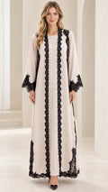 Front full-length view of cream modest maxi abaya dress with black lace trim