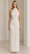 Front view of model wearing Ivory 3D floral applique halter maxi evening dress
