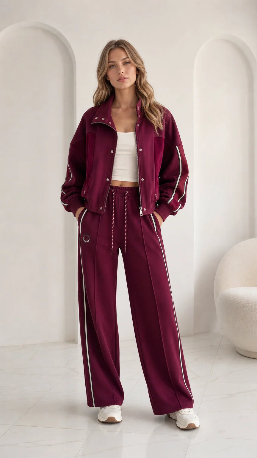 Women's burgundy 2-piece tracksuit set with zip jacket and wide leg pants front view