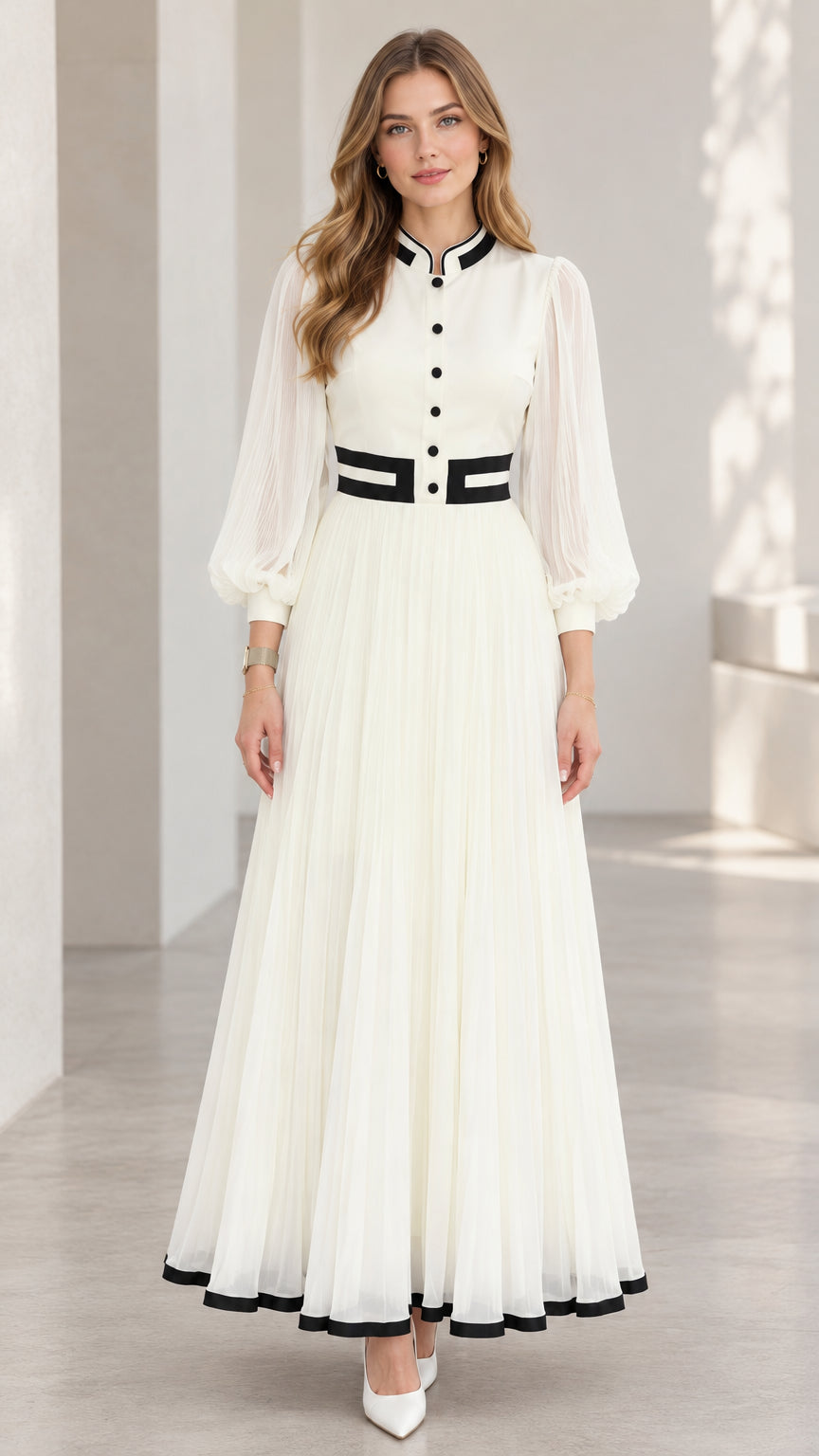 Front full-length view of woman wearing white pleated lantern sleeve maxi dress with black contrast trim