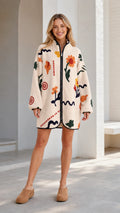 Front view of a cream women's floral printed fleece zip-up jacket with stand collar