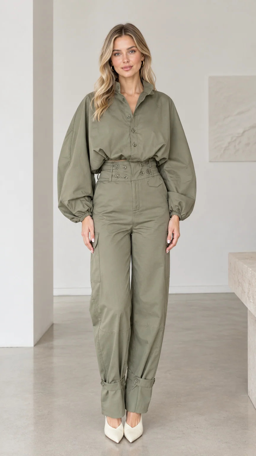 Front full-length view of woman wearing olive green lantern sleeve cargo jumpsuit