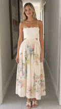 Woman wearing ivory floral cutout midi dress front view
