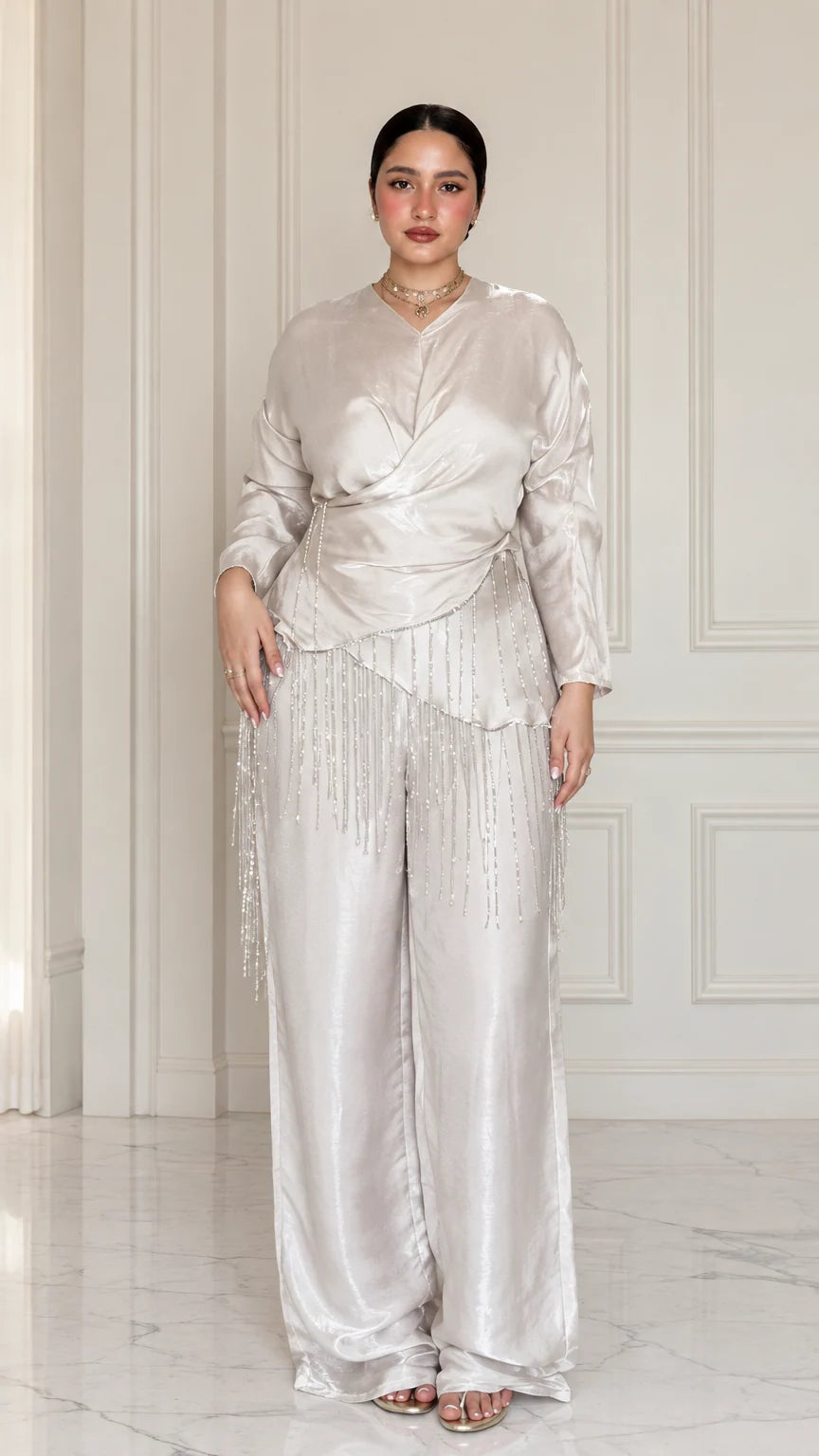 Front full view of Champagne satin draped wrap top with beaded fringe and wide-leg trousers