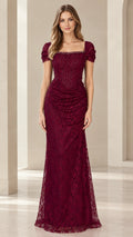 Front view of model wearing Burgundy beaded lace corset evening gown with puff sleeves