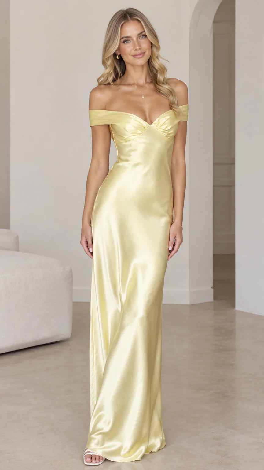 Front view of woman wearing butter yellow off-the-shoulder satin maxi dress