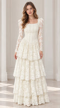 Front view of model wearing ivory long sleeve tiered lace maxi dress